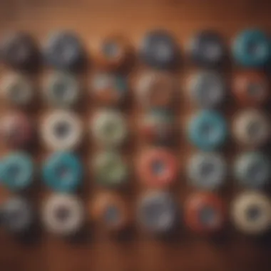 Different types of skateboard wheels displayed on a wooden surface.