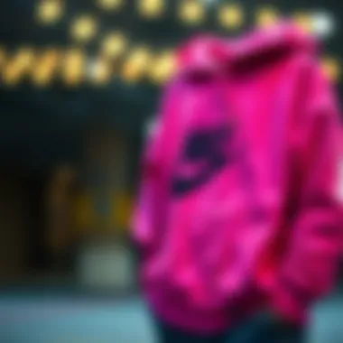 Care tips for the pink Nike sweatshirt displayed visually