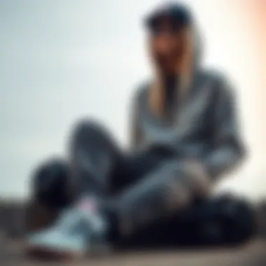 Stylish arrangement of Champion zipper sweatpants with skateboarding gear