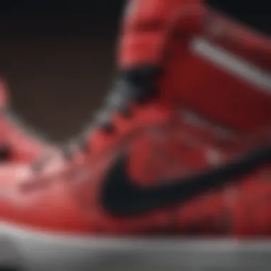 Close-up of design details on red, black, and white Nike sneakers