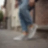 Stylish grey suede Vans slip-ons on a skateboard