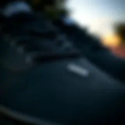 A close-up of black Vans showcasing their textured surface and design details