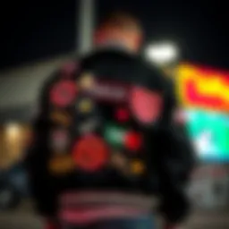A black letterman jacket adorned with unique patches and embroidery, showcasing its design in skate culture.