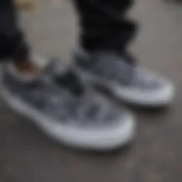 Close-up of black tie dye Vans with intricate patterns