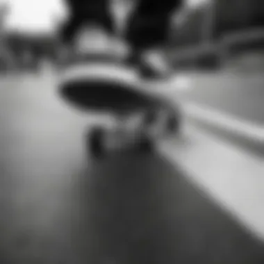 Skateboarding Tricks on Black and White Deck Close-up of a skateboarder performing tricks on a black and white deck