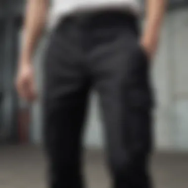 Close-up of the fabric and detailing of black cargo pants showcasing quality and texture