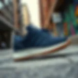 Stylish navy Adidas shoes showcased on a trendy urban background