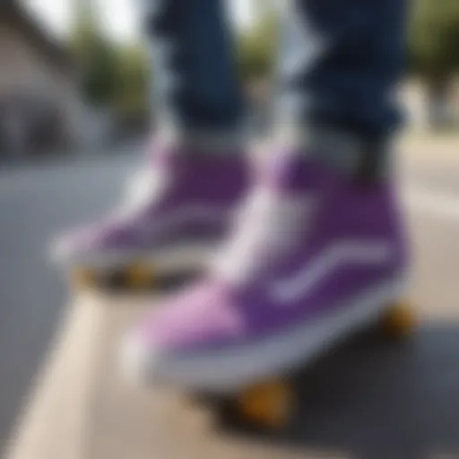 A close-up view of purple Vans sneakers on a skateboard