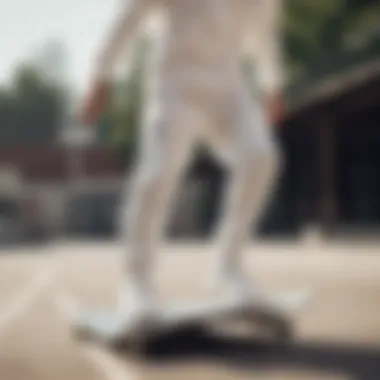 Skater wearing white Adidas sweats performing a trick