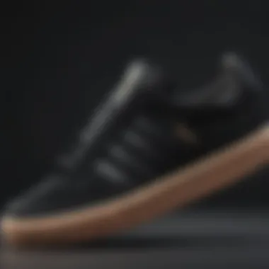 Close-up of Black Adidas Sneaker Detailing Close-up of black Adidas sneaker detailing.