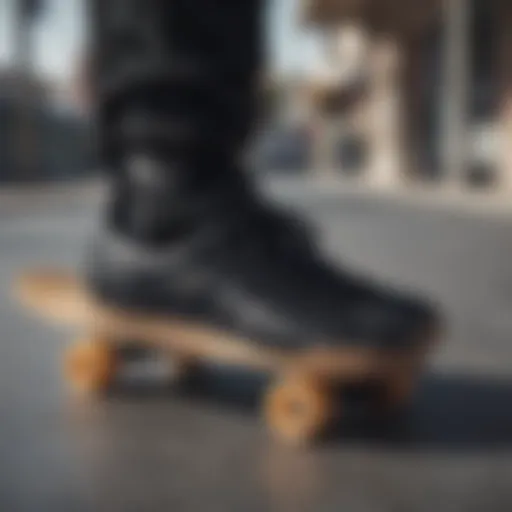 Stylish black Adidas sneakers on a skateboard.