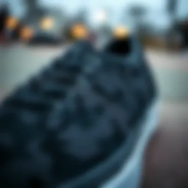 Close-up of black camouflage Vans showcasing design details