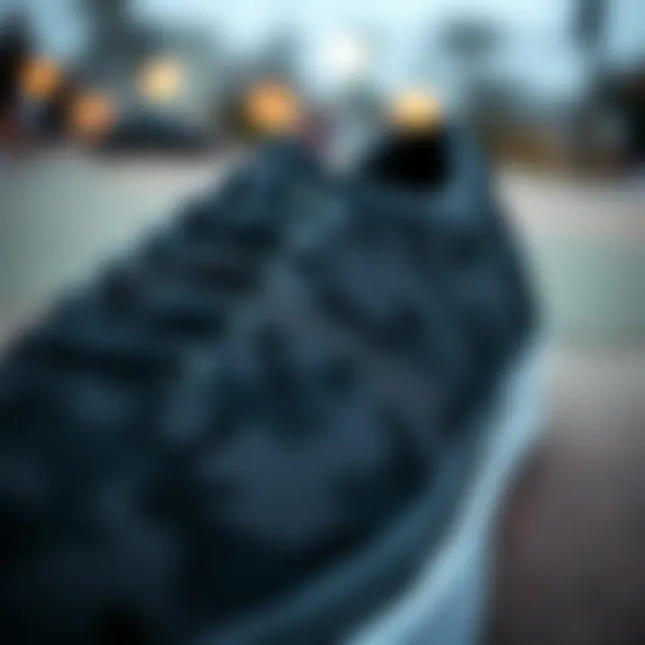Close-up of black camouflage Vans showcasing design details