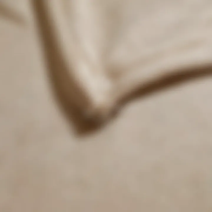 Close-up of the fabric texture of a cream zip hoodie