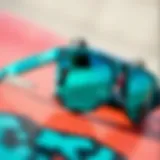 A pair of turquoise sunglasses against a skateboard background