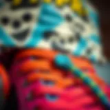 A close-up view of a colorful shoelace belt styled with skate gear