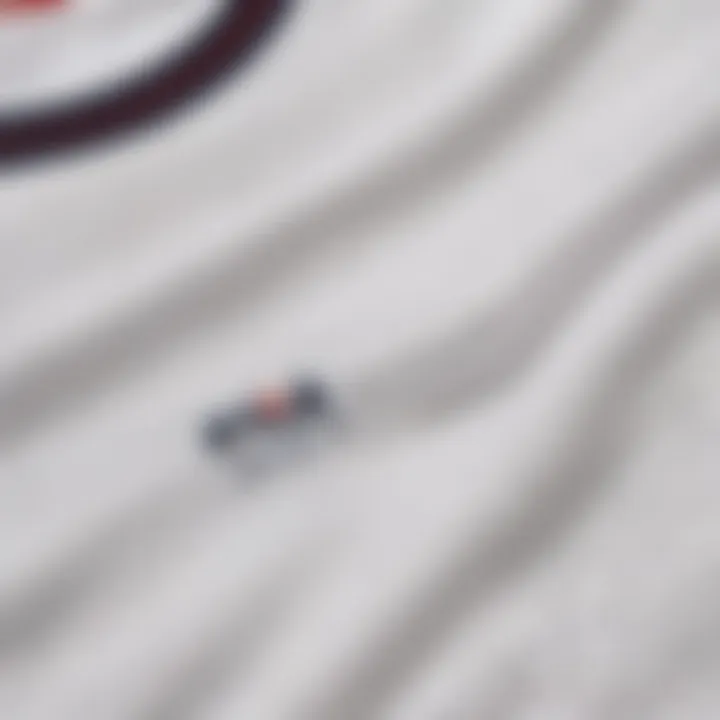 Close-up of fabric quality of white Fila t-shirt