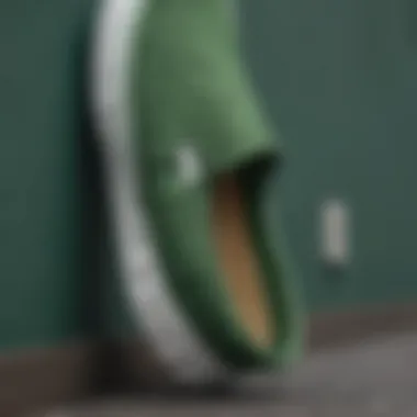 Detailed View of Green Vans Slip-On Fabric Close-up of the fabric texture of green Vans slip-on shoes