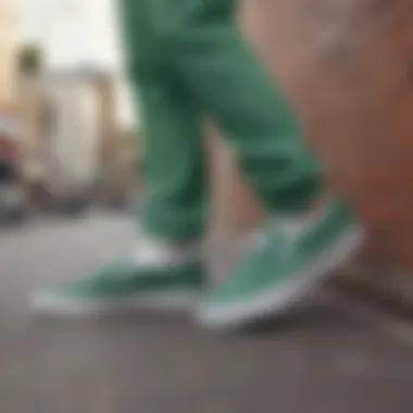 Group of skateboarders wearing green Vans slip-on shoes in action