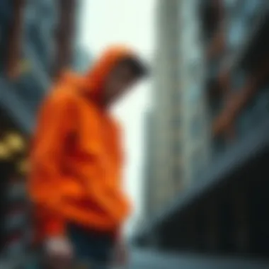 Urban Aesthetic with Hunter Orange Hoodie Urban skater wearing a hunter orange hoodie in an urban setting.