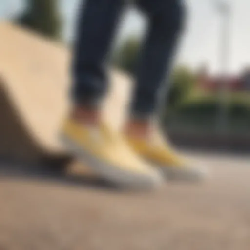 A stylish pair of light yellow slip-on Vans on a skateboarding ramp