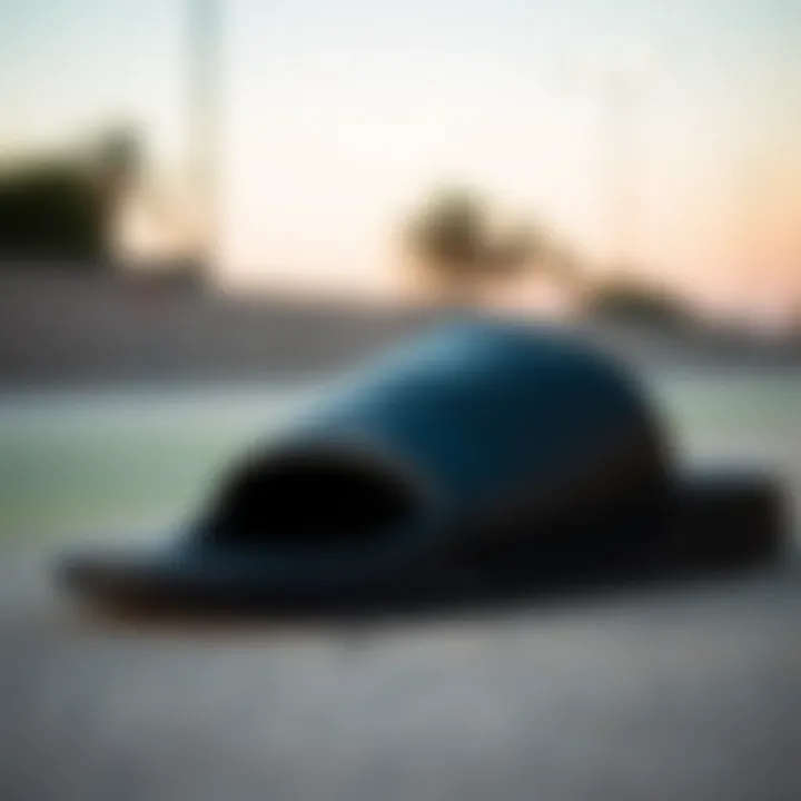 Close-up view of the Nike Benassi sliders in black showcasing the sleek design and logo.