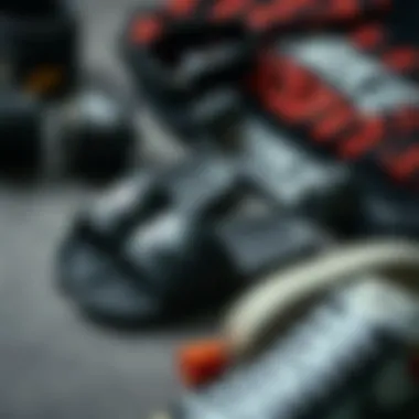 Fashion Meets Function: Flat Lay of Nike Benassi Sliders Flat lay of Nike Benassi sliders in black next to skateboarding accessories and streetwear.
