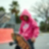A vibrant pink Nike sweatshirt showcased on a skateboard