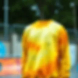 Vibrant yellow tie dye sweatshirt in a skate park setting