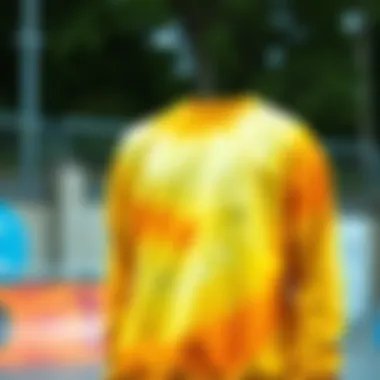 Vibrant yellow tie dye sweatshirt in a skate park setting