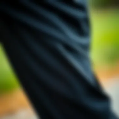 Close-up of the fabric texture of black Nike track pants