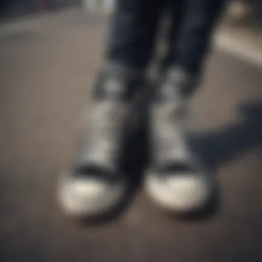 Converse Sneakers on Skateboard A pair of stylish Converse black sneakers on a skateboard.