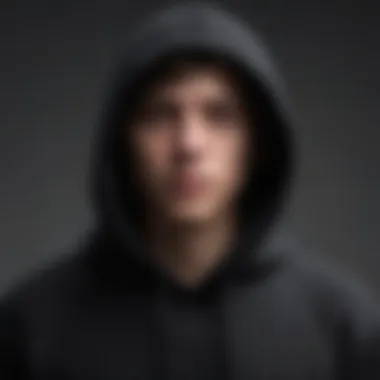 Lightweight Fabric of a Black Thin Hoodie Close-up of black thin hoodie fabric highlighting its lightweight texture.