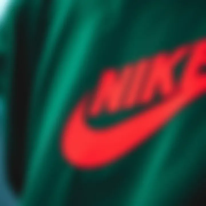 Close-up of the dark green Nike crew neck's logo and design details
