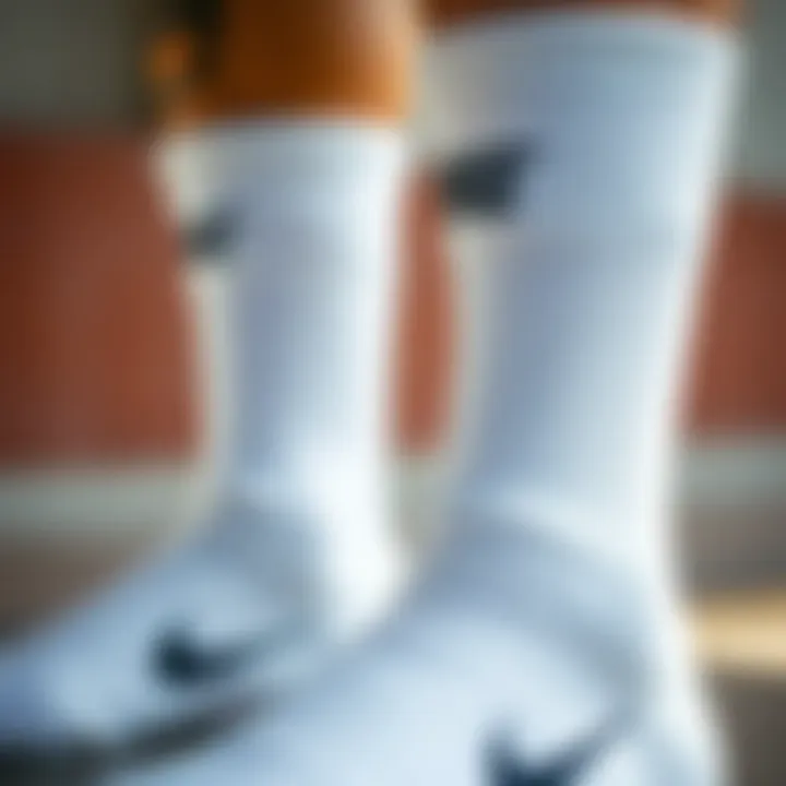 Close-up of white Nike tube socks with branding detail