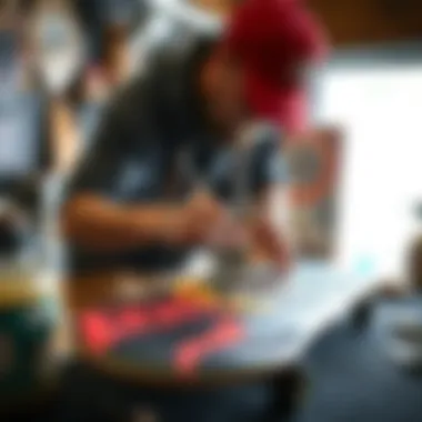 An artist painting a custom design on an antihero skateboard deck