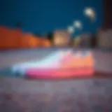Stylish pair of Vans white perforated slip-ons on a concrete surface